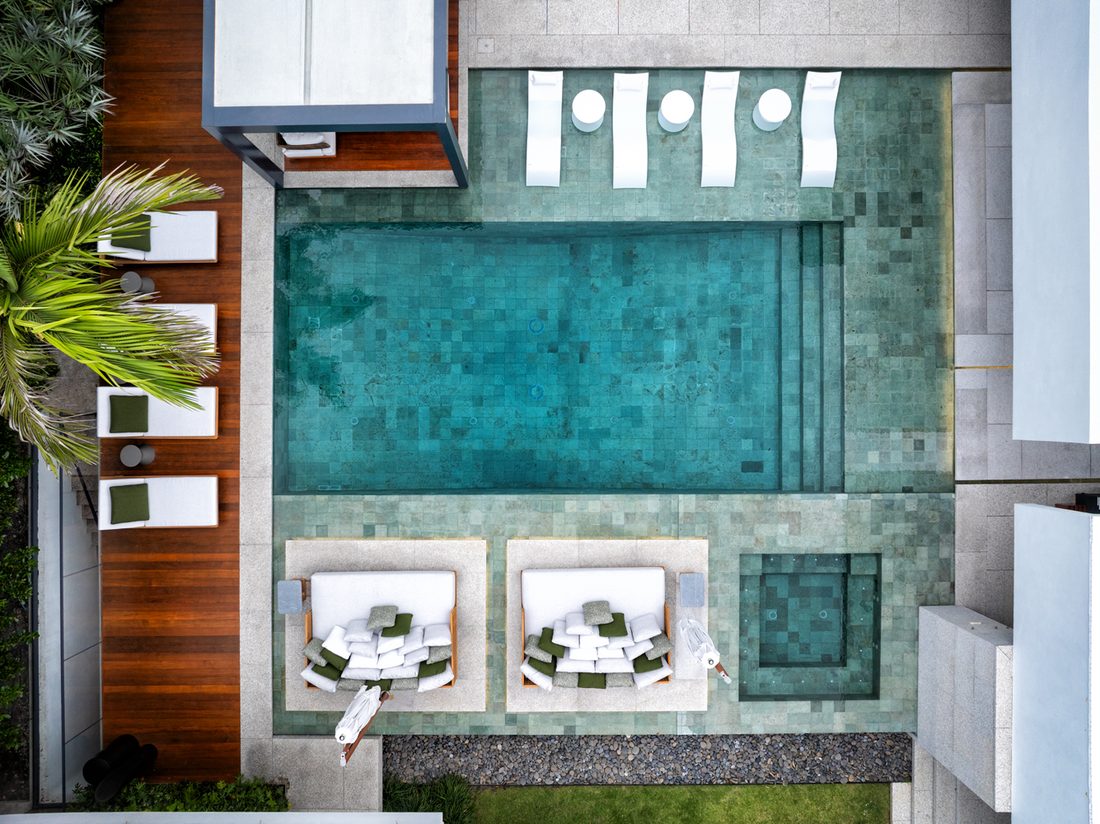 Aerial top-down view of the renovated pool, terrace and spa
