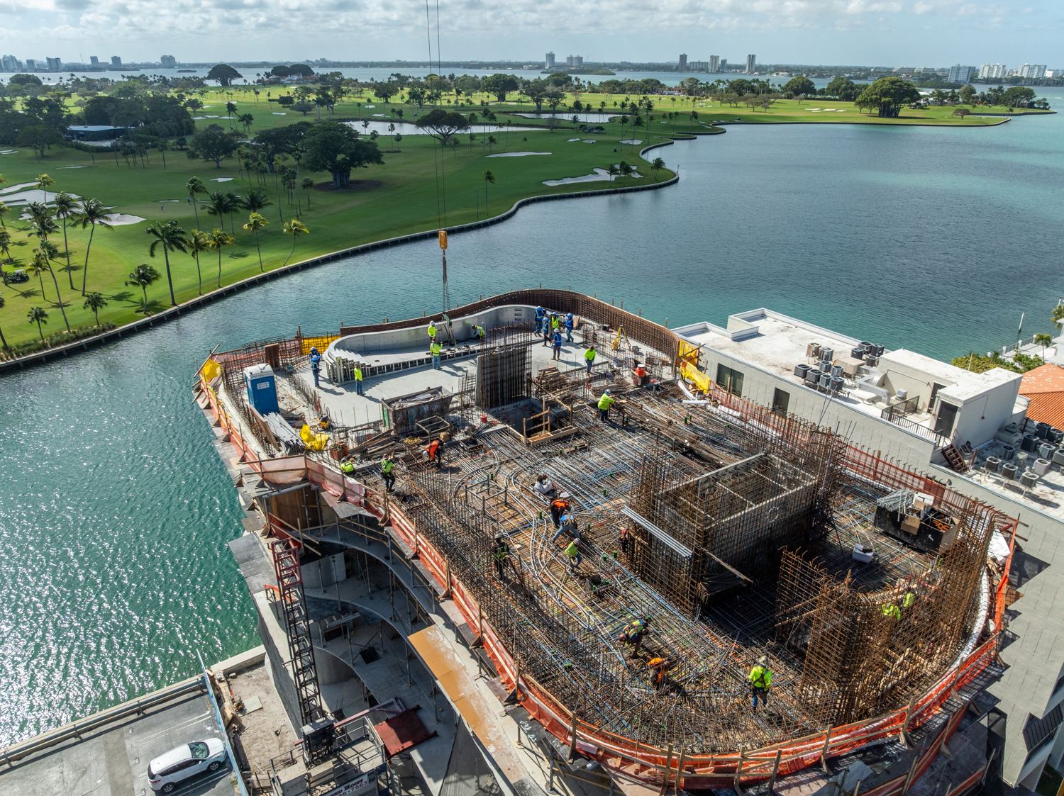 Aerial view of the waterfront tower with its rooftop stainless steel pool