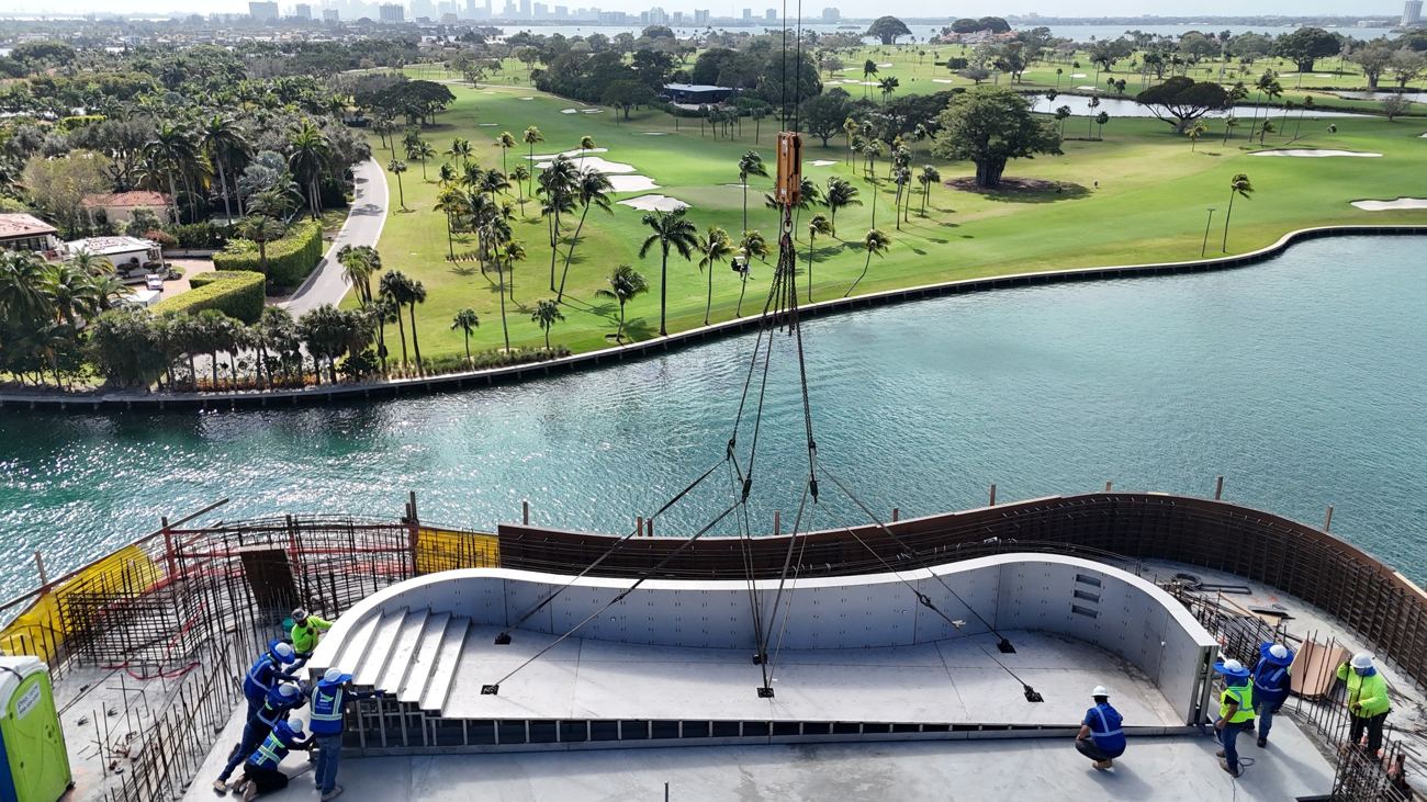Stainless steel pool shell in place on a rooftop overlooking the water and a golf course