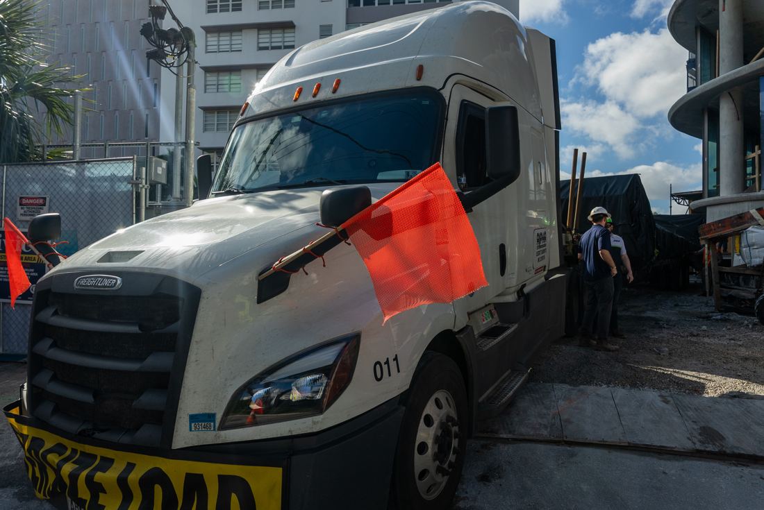 Truck delivering the pool shell to the construction site